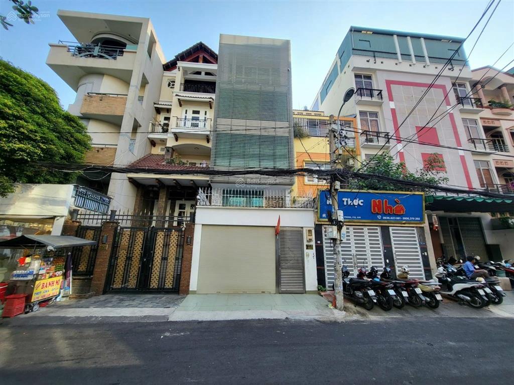 (hot)hạ 4 tỷ bán tòa mt giải phóng 5,6x17m 1 hầm 6 lầu nhà cứng đẹpvị trí sân bay t1chỉ 19,8 tỷ